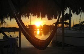 Placencia sunset with hammock by a harbor – Best Places In The World To Retire – International Living
